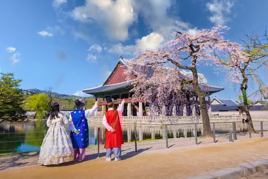 Korean teenagers with Korean traditional dress Hanbok in Gyeongbokgung palace in spring, seoul, south korea. photo