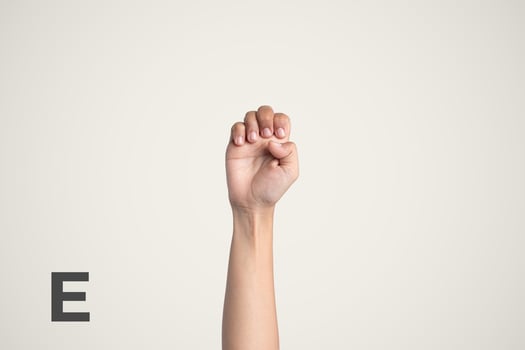 Deaf Sign alphabet of E, American Sign Language ASL. Isolated object Finger spelling the alphabet photo