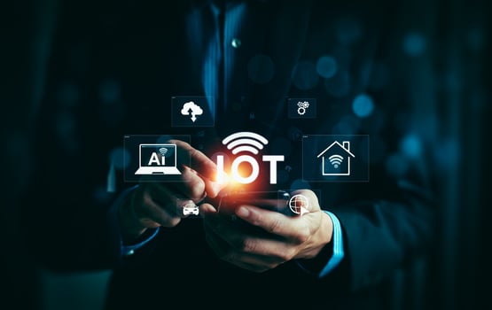 Businessman Using Smartphone to Access Internet of Things IoT with AI, Cloud, Smart Home, and Connected Devices Technology Icons Highlighting Digital Innovation and Connectivity photo