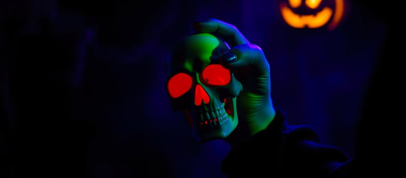 glowing skull held by a hand photo