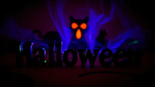 illuminated wooden halloween letters with a spooky glow photo
