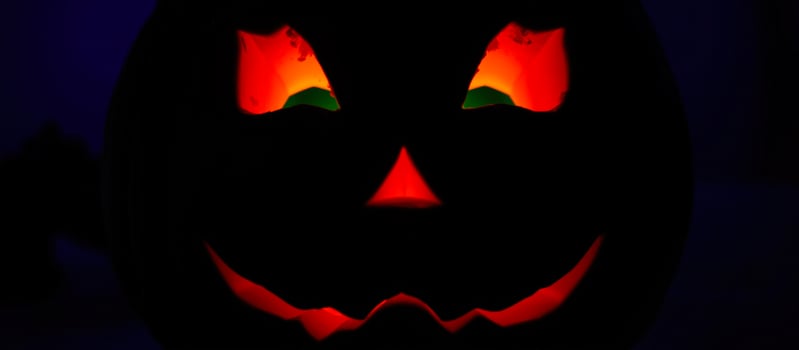 glowing pumpkin with a spooky smile photo