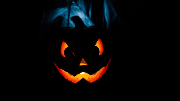 glowing jack-o'-lantern with a sinister smile photo