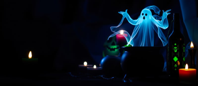 luminous blue ghost hovering above a black cauldron photo