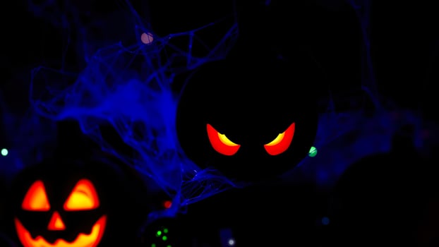glowing jack-o'-lantern with sinister eyes photo