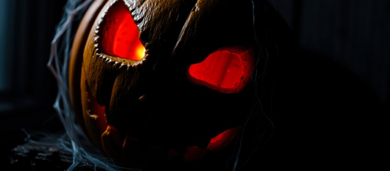 glowing pumpkin with red eyes photo