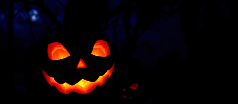 glowing carved pumpkin with a sinister grin photo