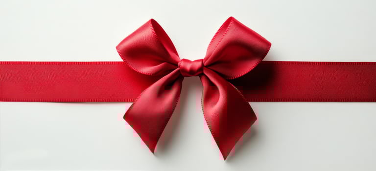 A beautifully crafted red ribbon and bow on a white background creating an elegant gift wrap photo