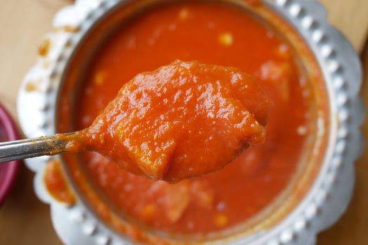 fresh tomato soup on table photo