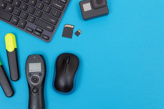 Top View of Photographer's, Videographer's or Blogger's Workplace. Digital Gadgets Lying on Blue Table - Flat Lay photo