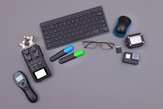 Top View of Blogger's Workplace. Digital Gadgets Lying on Grey Table - Flat Lay photo