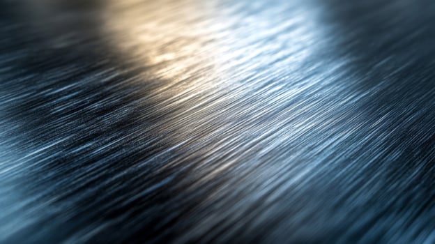 Close-up of a Brushed Metal Surface with a Subtle Light Reflection photo