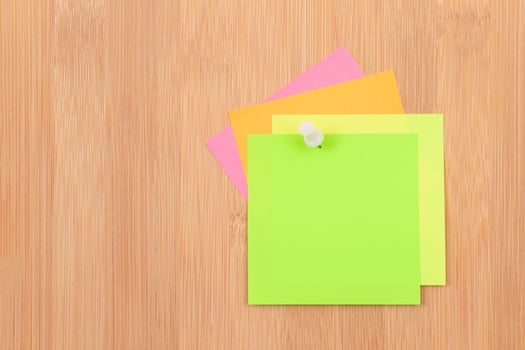 Colored Sticky Notes with Copyspace Pinned to the Wooden Message Board. To Do List Reminder in Office. Blank Memo Sticker at Work - Template. Empty Checklist - Mockup photo