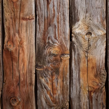 A close up of a wooden wall with many different types of wood photo