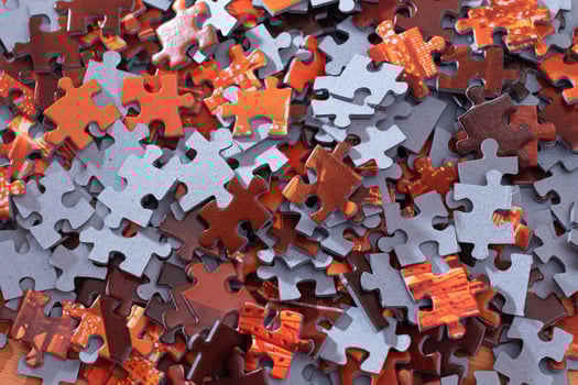 Top View of Mixed Pieces of a Jigsaw Puzzle - Texture Background photo
