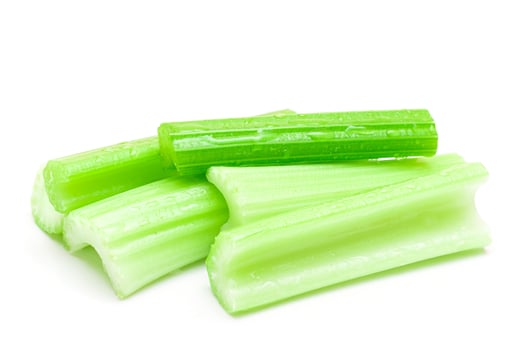 Fresh Chopped Celery Sticks with Water Drops Isolated on White Background. Vegan and Vegetarian Culture. Raw Food. Healthy Diet with Negative Calorie Content photo