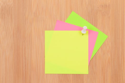 Colored Sticky Notes with Copyspace Pinned to the Wooden Message Board. To Do List Reminder in Office. Blank Memo Sticker at Work - Template. Empty Checklist - Mockup photo