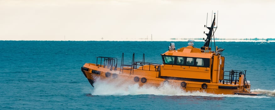 Orange pilot ship moving fast in Baltic sea. Europe photo