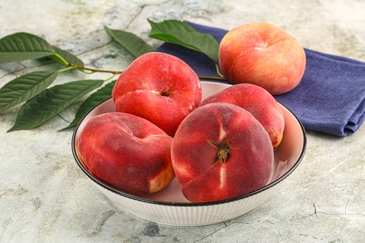 Ripe sweet and juicy Flat peach photo