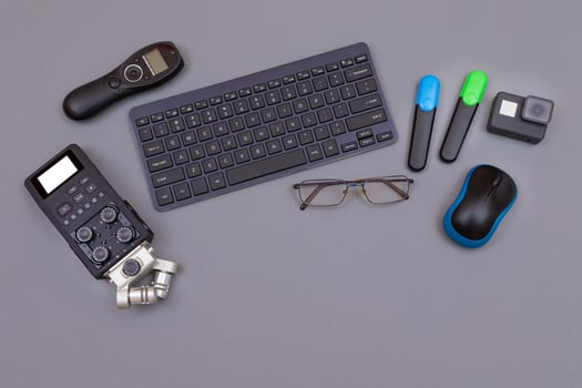 Top View of Blogger's Workplace. Digital Gadgets Lying on Grey Table - Flat Lay photo