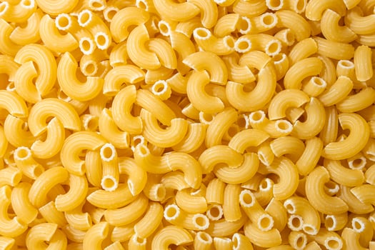 Uncooked Chifferi Rigati Pasta. A Culinary Canvas of Chifferi Rigati, Creating a Lively and Textured Background for Gourmet Cooking. Dry Pasta. Raw Macaroni - Top View, Flat Lay photo