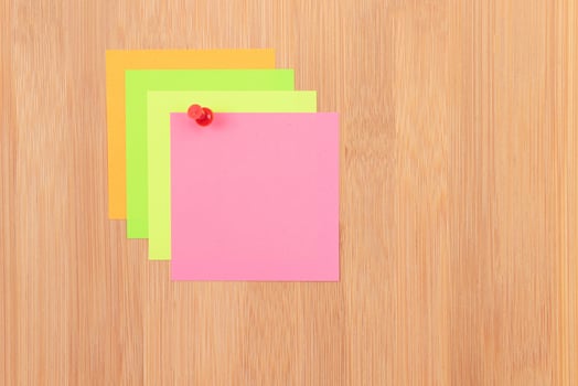 Colored Sticky Notes with Copyspace Pinned to the Wooden Message Board. To Do List Reminder in Office. Blank Memo Sticker at Work - Template. Empty Checklist - Mockup photo