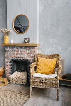 Grey living room and yellow room with fireplace and wooden decor. The style of the living room is Scandinavian. photo