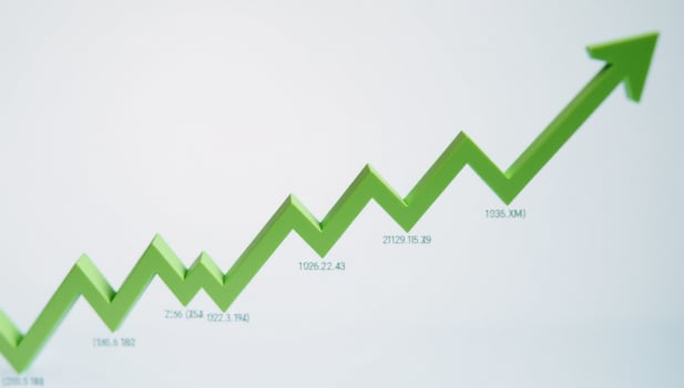 A green businessrelated line graph on an arrows background file format photo