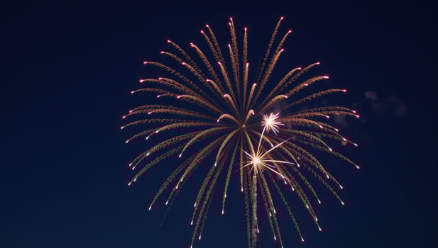 Fireworks illuminate the night sky with an indistinguishable glow photo
