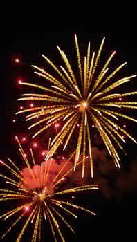 Isolated golden fireworks against a black backdrop photo