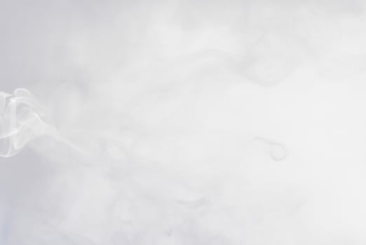 Soft white smoke or mist floating on a light background, perfect for abstract, atmospheric, or ethereal designs. photo
