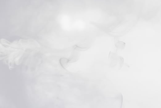 Soft white smoke or mist floating on a light background, perfect for abstract, atmospheric, or ethereal designs. photo