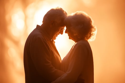 A loving couple embraces each other during a golden sunset, capturing a moment of intimacy and connection photo