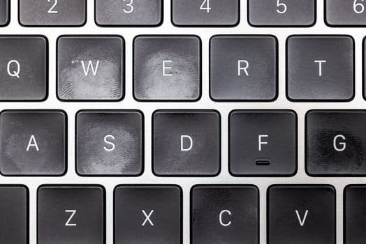 keyboard of famous silver colored laptop with fingerprints photo