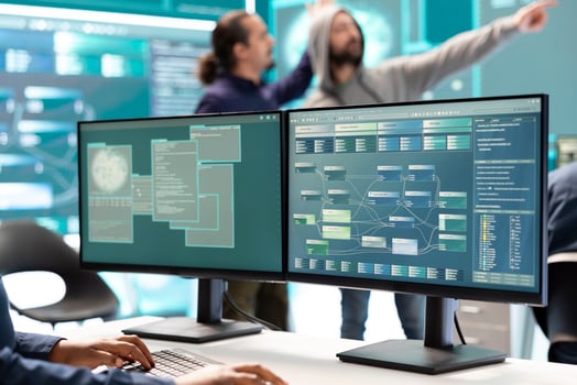 Cyber security experts working on spyware and malware detection in a governmental agency center. Examining server and database info on a big screen to combat cyberterrorism, hacking team. photo