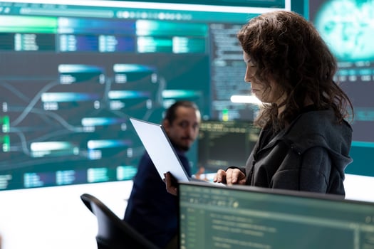 Cyber security team investigates governmental hacking malware attack on internet servers, high tech office. Cybercriminals hack computer systems, threatening account database protection. photo