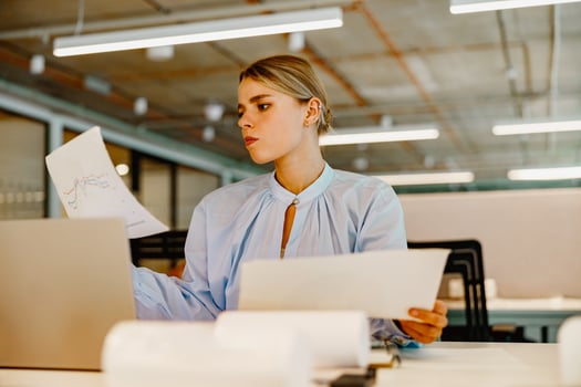 A focused and dedicated professional working in a dynamic and modern office environment photo