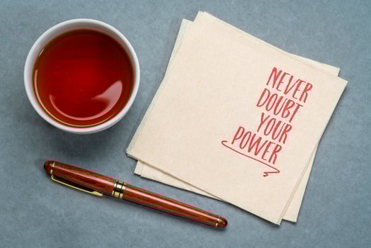 never doubt your power - insopirational reminder note on a napkin, confidence and personal development concept photo