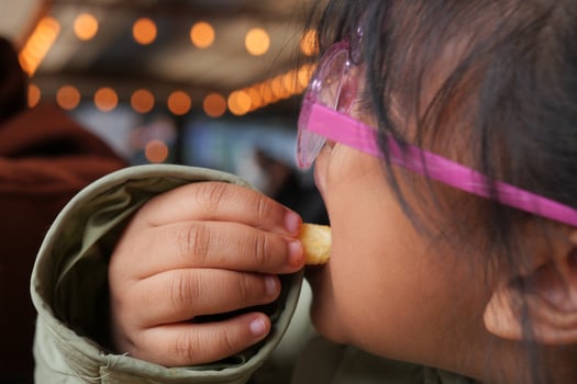 child eating french fries close up photo