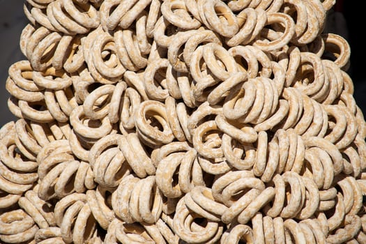 Artistic close-up of traditional round bread rings varieties stacked together photo