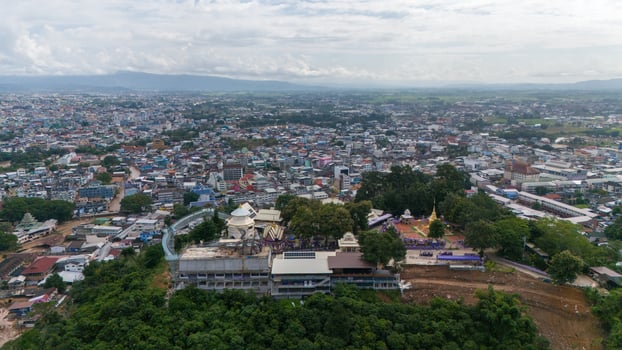 Aerial view of Wat Phrathat Doi Wao temple with Mae Sai downtown in the background. Mae Sai is the northern point in Thailand at the border to Myanmar. photo