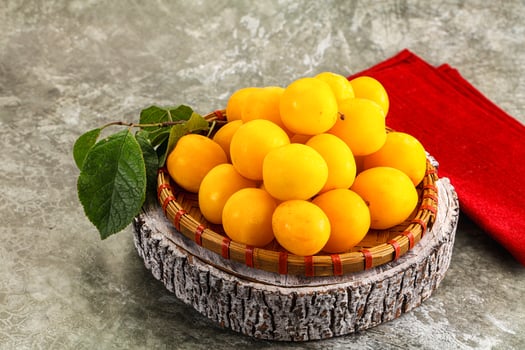 Ripe sweet juicy yellow plum photo