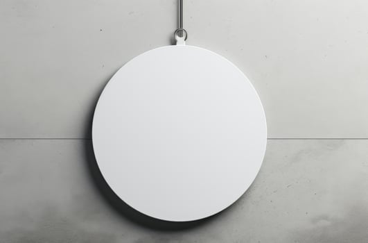 Blank Round Sign Hanging on Gray Wall photo