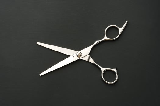Hairdressing scissors on black background studio shot photo