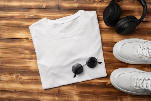 Cotton T-shirt mock up on wooden background flat lay photo