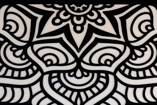 Intricate Black and White Mandala Design Filled With Swirls and Curves, Showcasing Artistic Creativity and Detail in the Artwork photo