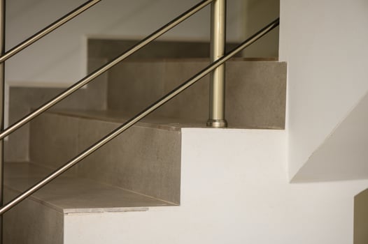 Elegant Staircase Design Featuring Sleek Railings and Minimalist Decor in a Modern Interior Space During Daytime photo