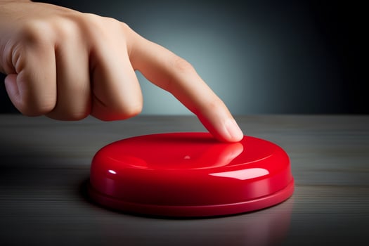 A hand presses a red button against a dark background, symbolizing the nuclear strike concept, evoking tension, authority, and the grave consequences of such an action. photo