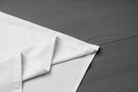 Cotton T-shirt mock up on wooden background flat lay photo