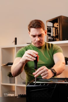 Man assembles a computer system unit at home photo